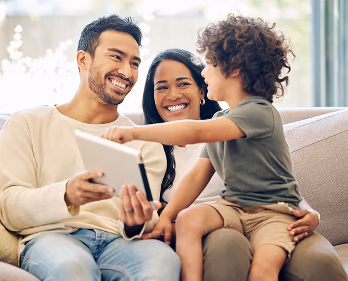 Parents and child with tablet